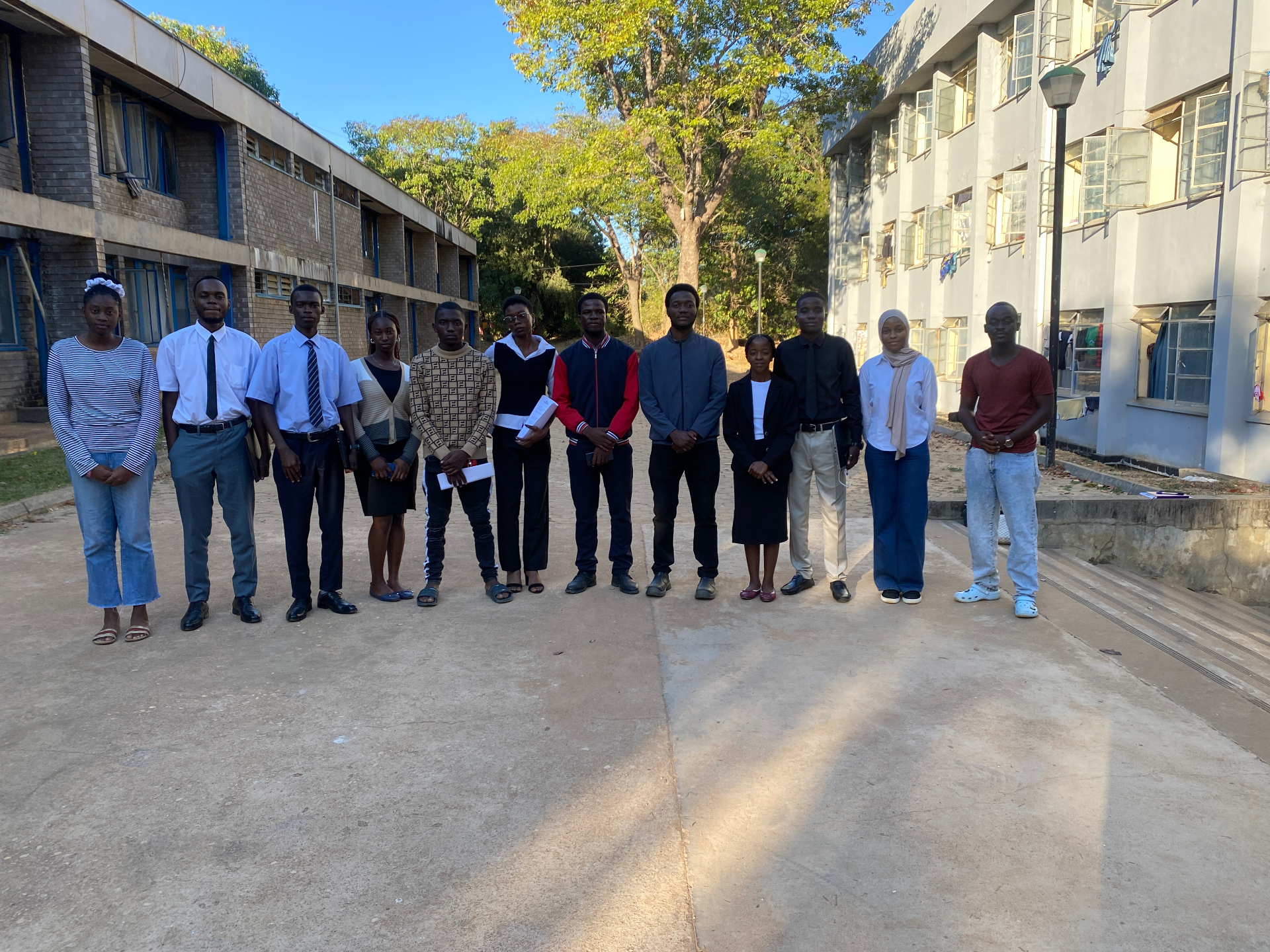 FORGE members lined up between campus buildings