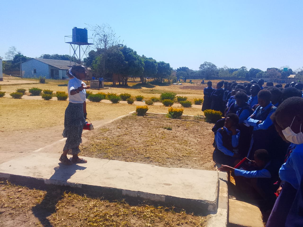 Forge Ambassador speaking to students with a megaphone