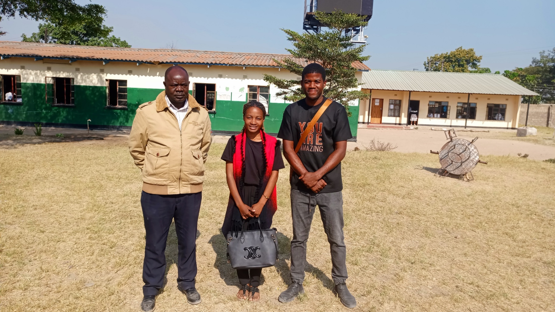 Forge Ambassadors with school leadership on the school grounds